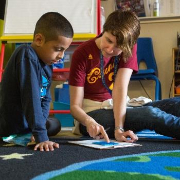 Teacher helping student with an assignment