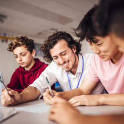 Students working with teacher in a PBL classroom