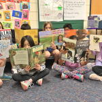 kids in a PBL classroom reading 