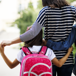 mom walking kids to school