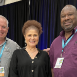 Dr. Lisa Delpit poses for a picture with Bob Lenz and John Gonzalez